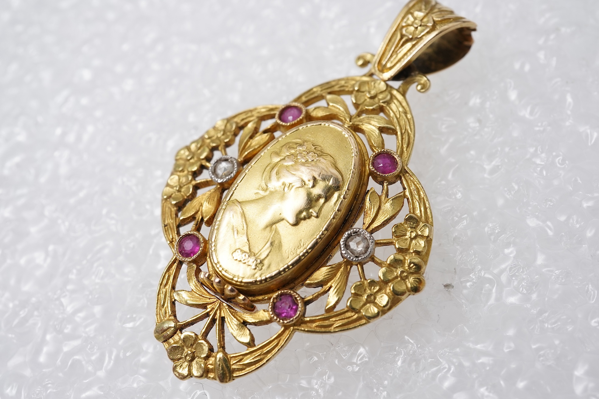 An Art Nouveau ruby and diamond locket pendant, France, circa 1900